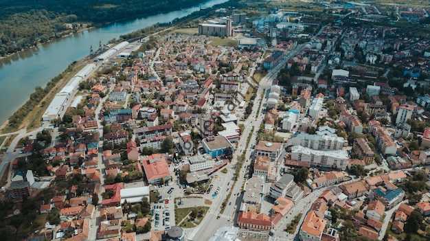 Free photo aerial shot of the brcko district full of tiny buildings on a sunny day